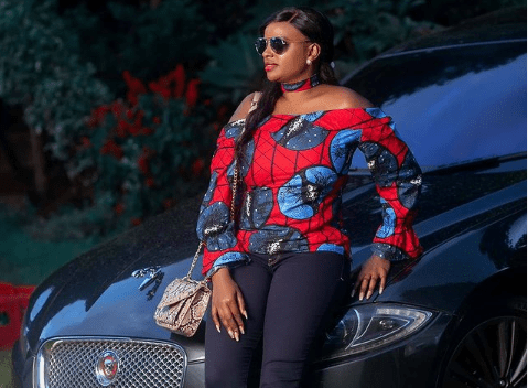 muthoni wa mukiri posing for a photo