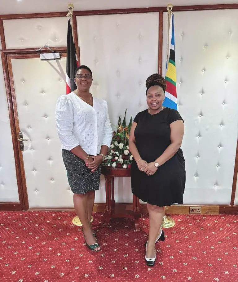 CS Aisha Jumwa and CAS Millicent Omanga in her office posing for a photo 